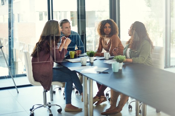 Cropped shot of a group of businesspeople having a meeting in an office